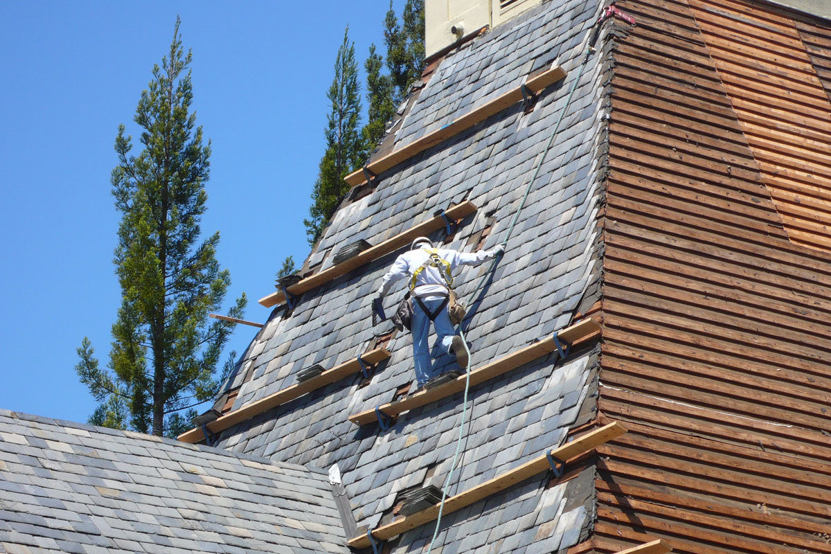 Crew on a steep slate roof