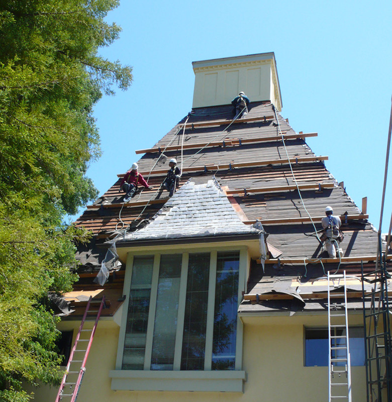 Crew working safely on a steep roof